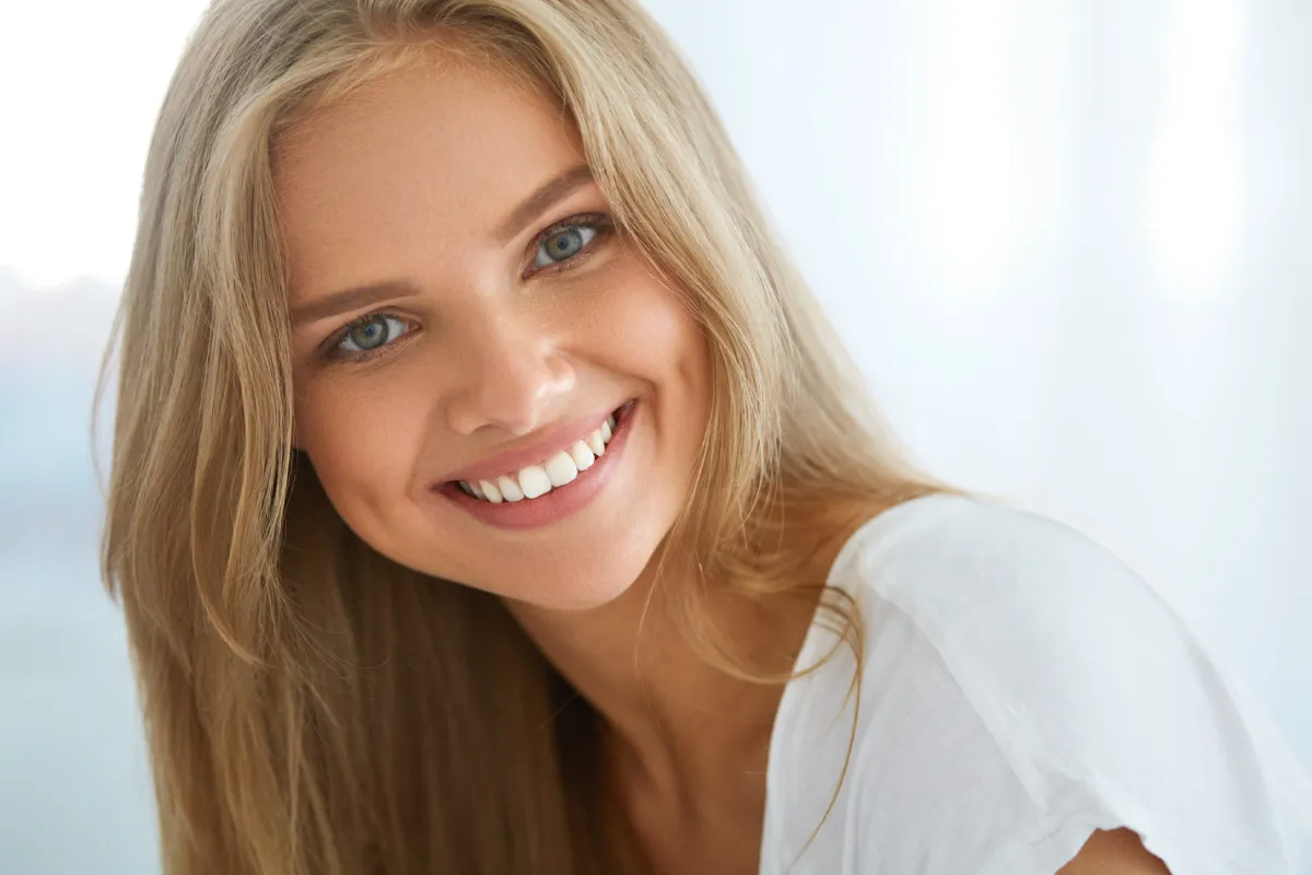Close up after results of healthy, even gums framing bright teeth following gum contouring at Paul B. Gabriel DMD
