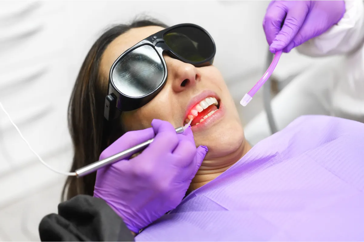 Woman receiving Laser Dentistry treatment for dental anxiety at Paul B. Gabriel DMD